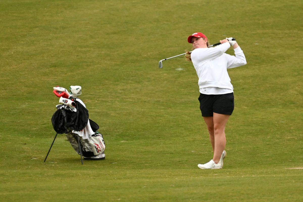 Freshman Ellise Rymer tees off on the 18th hole during the Wolfpack Match Play at Lonnie Poole Golf Course on Tuesday, April 9, 2024. The Wolfpack finished sixth overall in its final regular season stitch.