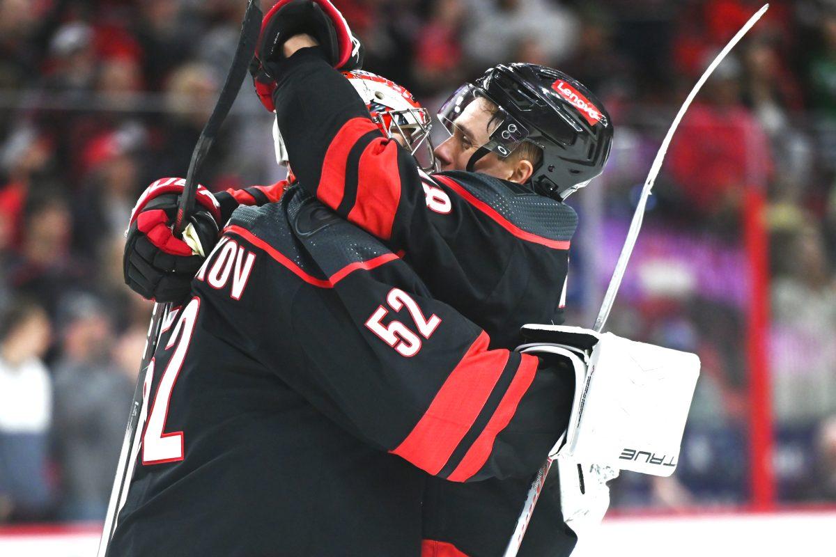 Center Jack Drury hugs goalie Pyotr Kochetkov after the Carolina Hurricanes game versus the Washington Capitals at PNC Arena on Friday, April 5, 2024. The Hurricanes beat the Capitals 4-2.