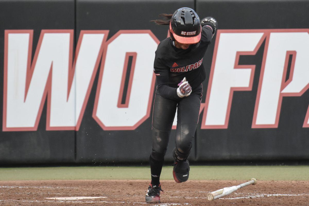 Sophomore utility player Makayla Marbury hits a bunt and sprints towards first base during the second game of the doubleheader against Queens University at Dail Softball Stadium on Tuesday, April 9, 2024. Marbury had two at bats with one run and one hit. NC State won the game 8-1.