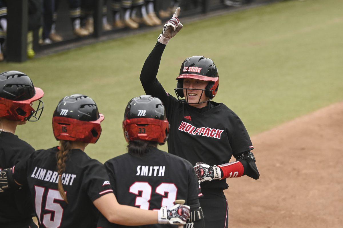 Sophomore outfielder Ellie Goins comes home after a home run during the Wolfpack's softball game against the Queens University Royals at the Dail Softball Stadium on Tuesday, April 9, 2024. The Wolfpack defeated the Royals in the first game of the doubleheader 7-1.