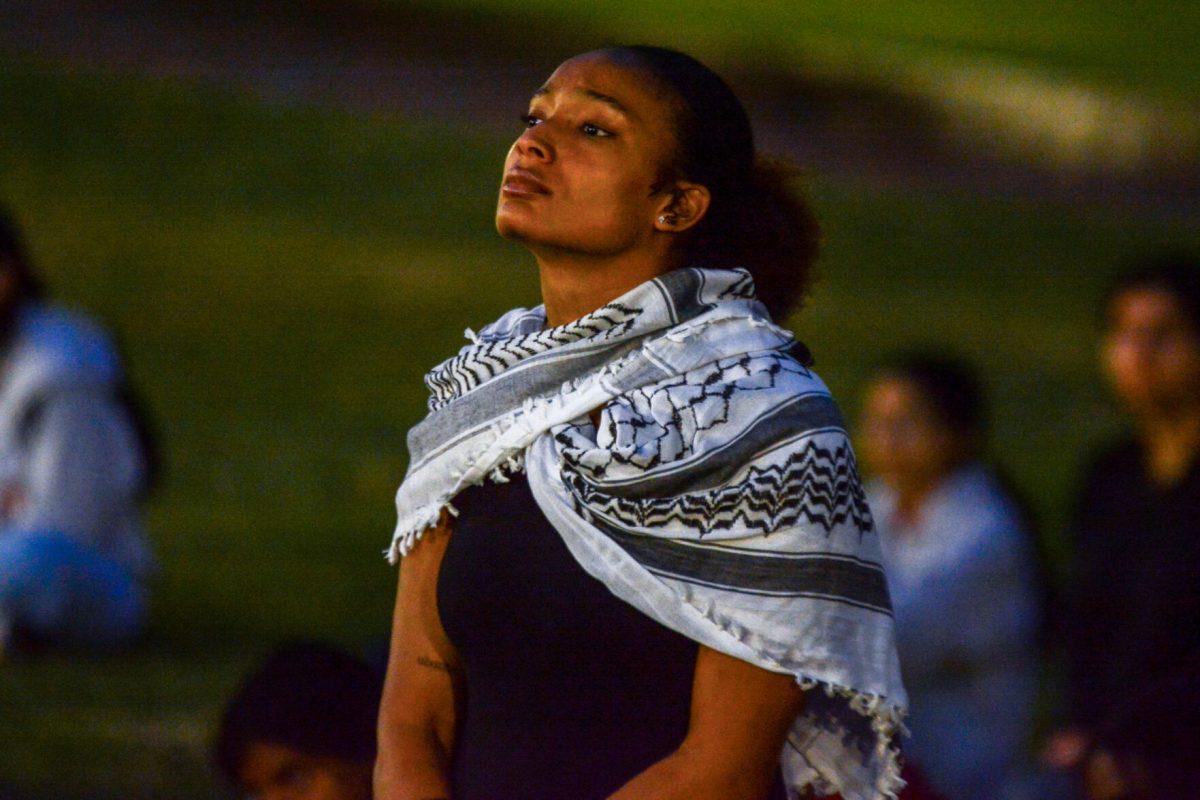 Dasia Washington, a member of Guilford College's Students for Justice in Palestine, stands at the Gaza vigil on Friday, April 19, 2024. Washington was a speaker at the event.