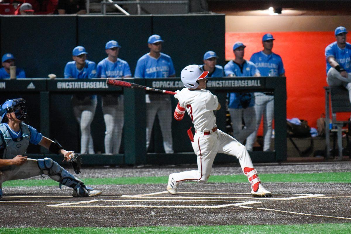 Junior infielder Brandon Butterworth hits a walk-off home run during the game against UNC in Doak Field at Dail Park on Thursday, April 18, 2024. Butterworth had two runs scored. The Wolfpack defeated the Tar Heels 9-8.
