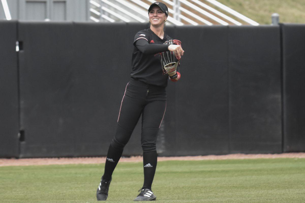 Sophomore outfielder Bailey Edwards throws the ball to her pitcher after catching the third out during the first game of the doubleheader against Queens University at Dail Softball Stadium on Tuesday, April 9, 2024. NC State won the game 7-1.