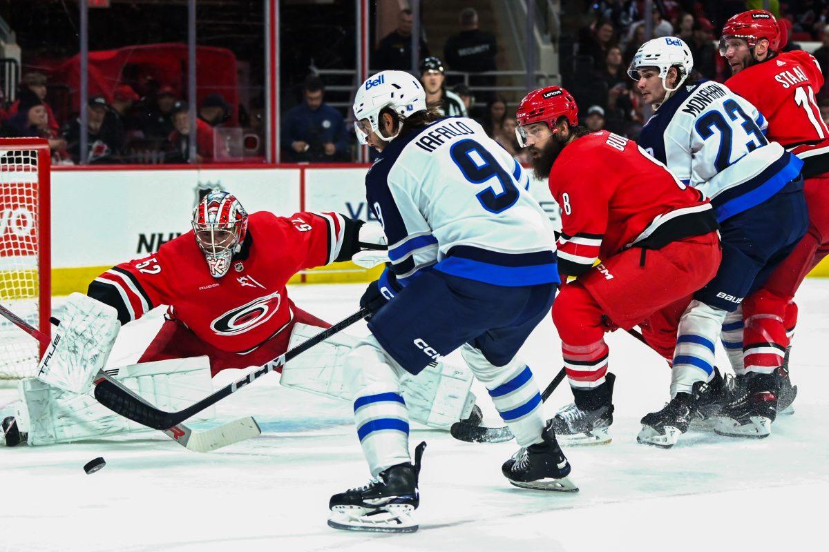 Defenseman Brent Burns and goalie Pyotr Kochetkov guard the goal during the Carolina Hurricanes game versus the Winnipeg Jets at PNC Arena on Saturday, March 2, 2024.&#160;The Jets beat the Hurricanes 5-3.