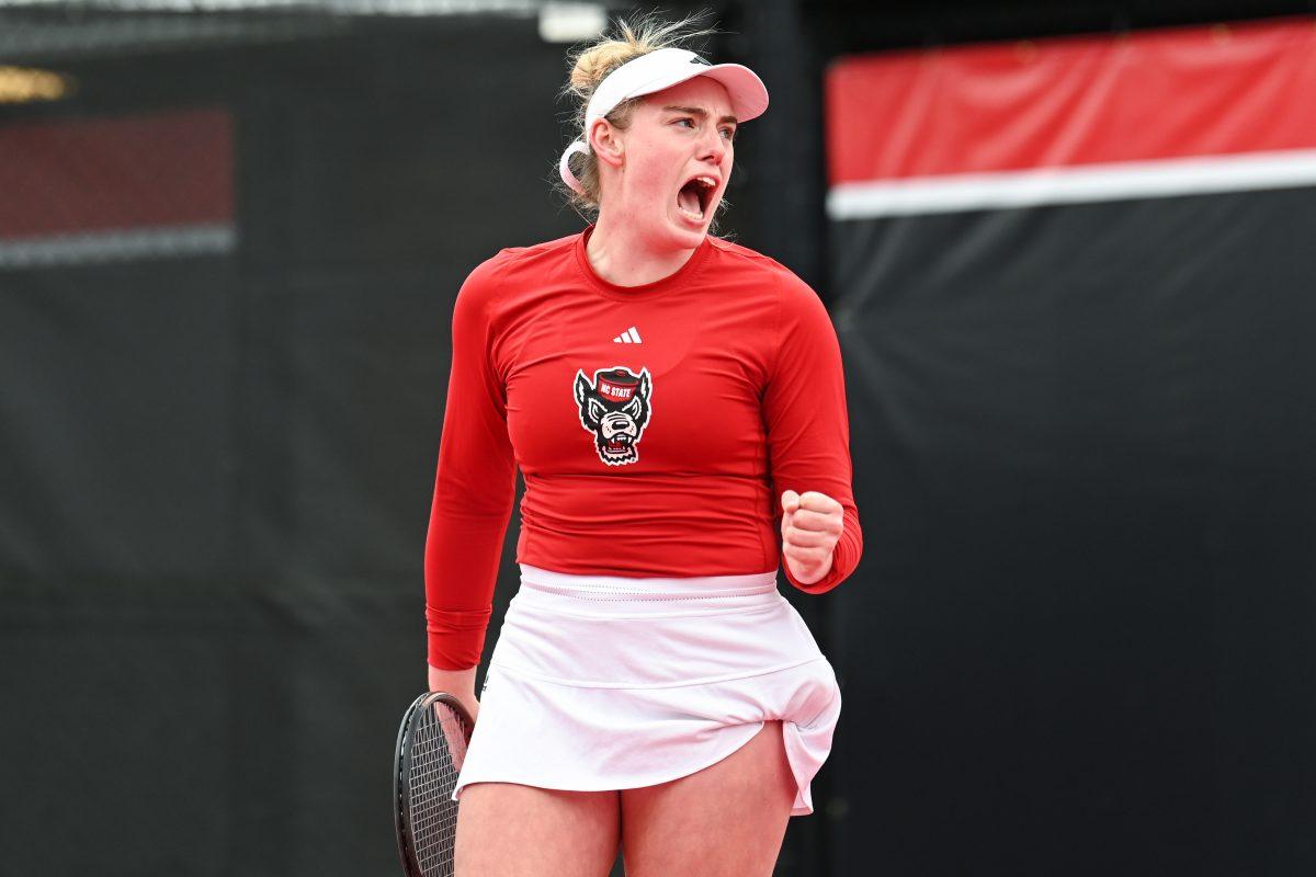 Senior Amelia Rajecki celebrates after scoring a point during the match against Notre Dame at Dail Outdoor Tennis Stadium on Friday, March 1, 2024. Rajecki won both her doubles and singles matches. NC State beat Notre Dame 5-2.