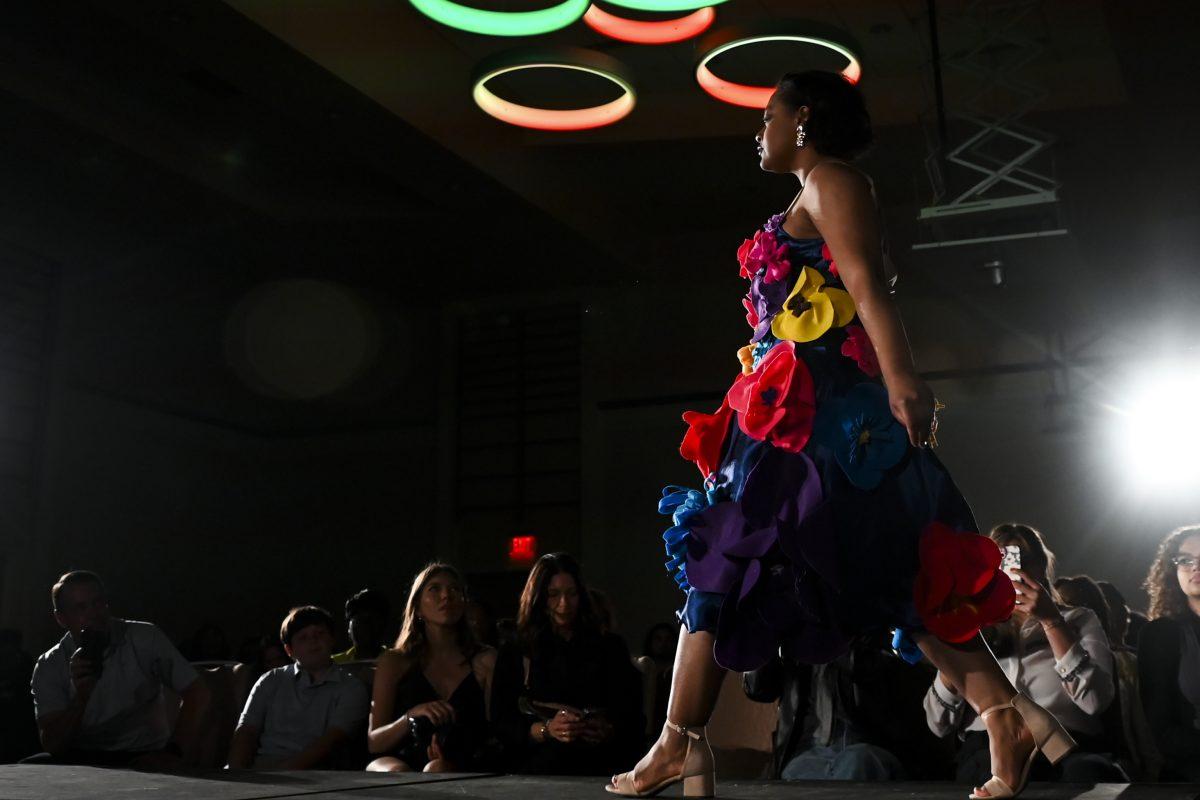 A model struts down the runway in a design from Jeana Grace Bowker's collection, "SALVAGED," at the 26th Annual Fashion Expose in Tally Student Union on April 8, 2024. The event was a part of Pan-Afrikan Week and was hosted by the African American Textile Society.