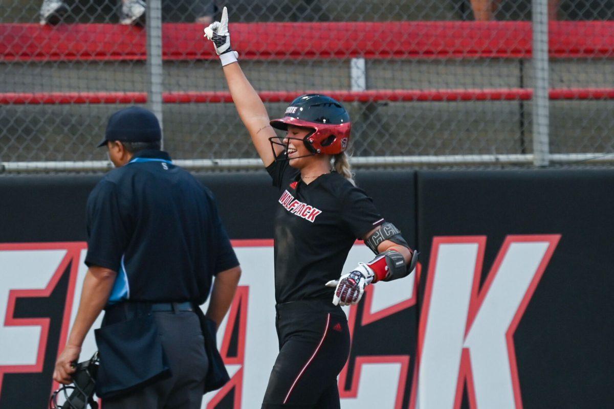 Sophomore utility player and pitcher Madison Inscoe celebrates after hitting a home run to the left center during the game against Elon at Dail Softball Stadium on Tuesday, April 2, 2024. Sophomore outfielder Gabi Wilson and freshman infielder Tori Ensley also scored from Inscoe's home run hit. NC state won the game 12-2.