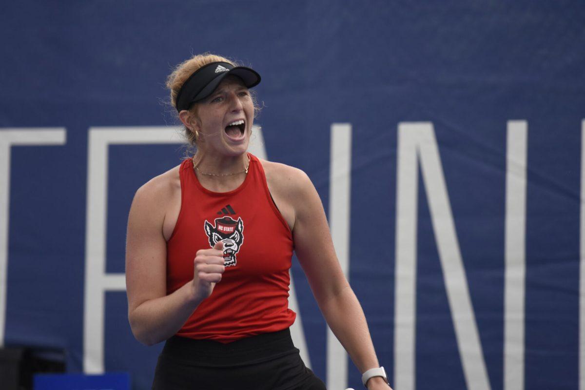 Freshman Maddy Zampardo pumps their fist and cheers after scoring a point during&#160;the ACC Tournament quarterfinals match against Clemson at Cary Tennis Park on Friday, April 19, 2024. Zampardo won their singles match. NC State beat Clemson 4-0.
