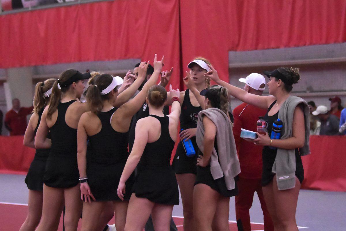 The NC State women's tennis team cheers after the doubles matches during the match against UNC-Chapel Hill at J.W. Isenhour Tennis Center on Friday, March 22, 2024.&#160;The Wolfpack beat the Tar Heels 4-3.