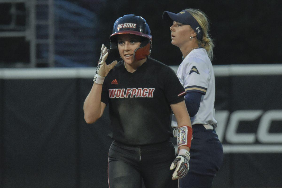Senior infielder Kaylee Lambrecht walks back to the dugout after getting tagged out during the second game of the doubleheader against Queens University at Dail Softball Stadium on Tuesday, April 9, 2024. Lambrecht had two at bats. NC State won the game 8-1.