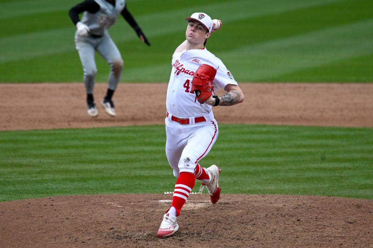 Freshman right-handed pitcher Jacob Dudan pitches during the baseball game against Towson at Doak Field at Dail Park on Friday, March 1, 2024. NC State defeated the Tigers 6-5.