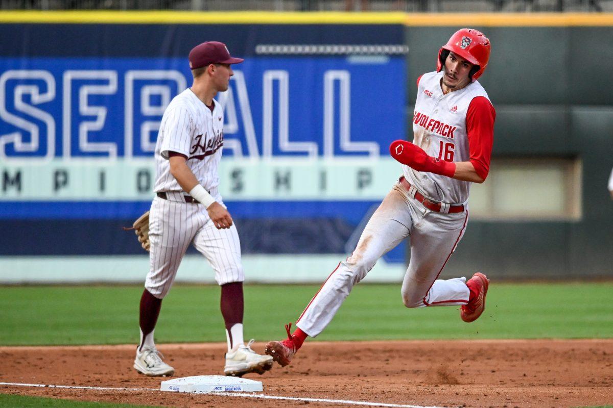 Sophomore outfielder Eli Serrano rounds third base during the ACC Tournament game against Virginia Tech at Truist Field in Charlotte on Wednesday, May 22, 2024. Serrano scored four runs and recorded two RBIs. NC State beat Virginia Tech 19-9 in eight innings.