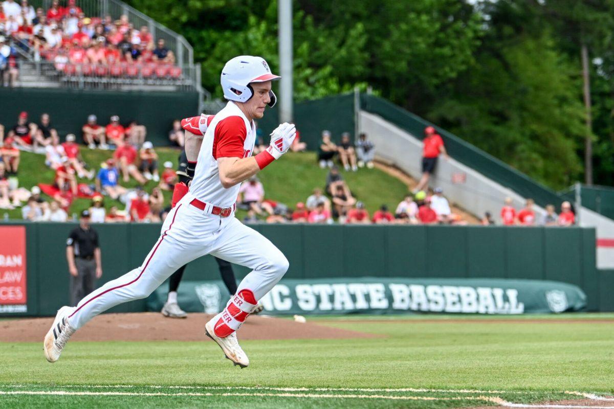 Junior infielder Brandon Butterworth runs to first base during the game against Wake Forest at Doak Field at Dail Park on Saturday, May 18, 2024. NC State beat Wake Forest 9-6 and swept the series.