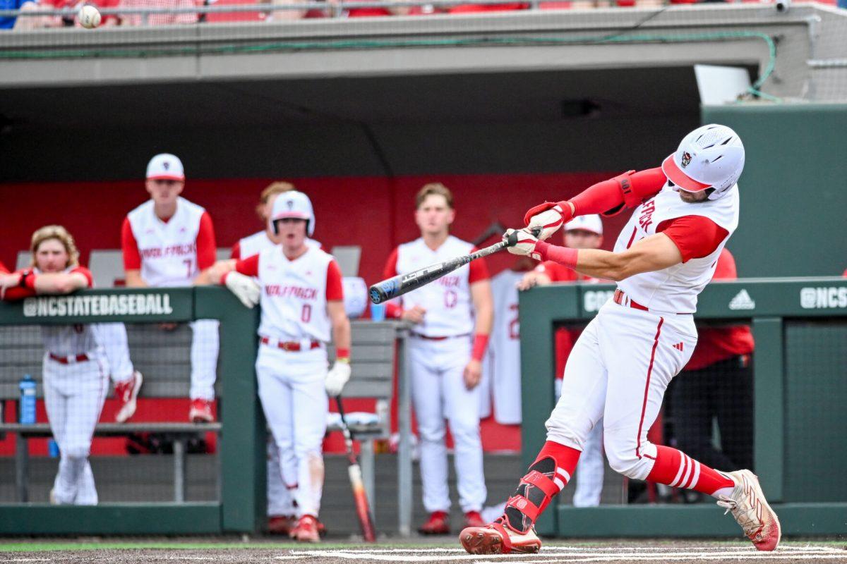 Junior catcher Jacob Cozart hits during the game against Wake Forest at Doak Field at Dail Park on Saturday, May 18, 2024. Cozart hit one home run and batted three runs in. NC State beat Wake Forest 9-6 and swept the series.