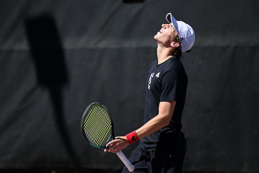 Sophomore Joseph Wayand leans his head back in frustration during the match against University of Virginia at the Dail Outdoor Tennis Stadium on Sunday, April 9, 2023. NC State lost 4-2 to Virginia.