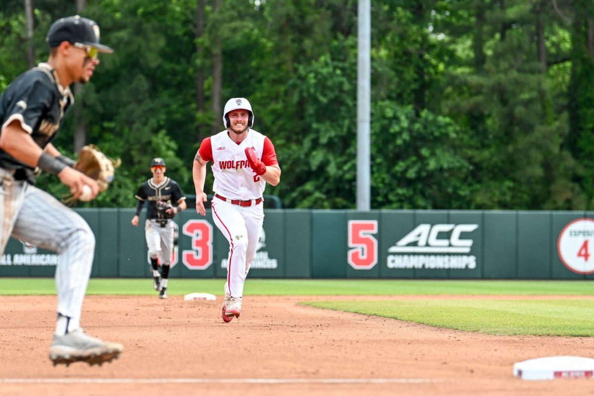 Senior outfielder Noah Soles attempts to tag third base during the game against Wake Forest at Doak Field at Dail Park on Saturday, May 18, 2024. Soles recorded one run. NC State beat Wake Forest 9-6 and swept the series.