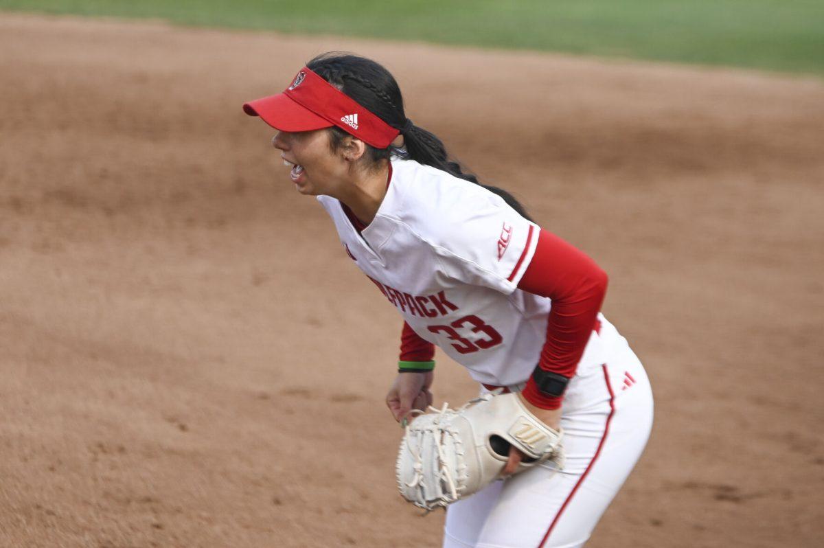 Junior first base player Alaina Smith yells at her teammates during the game against Duke at Dali Softball Field on April 26, 2024. NC State lost to Duke 4-3.