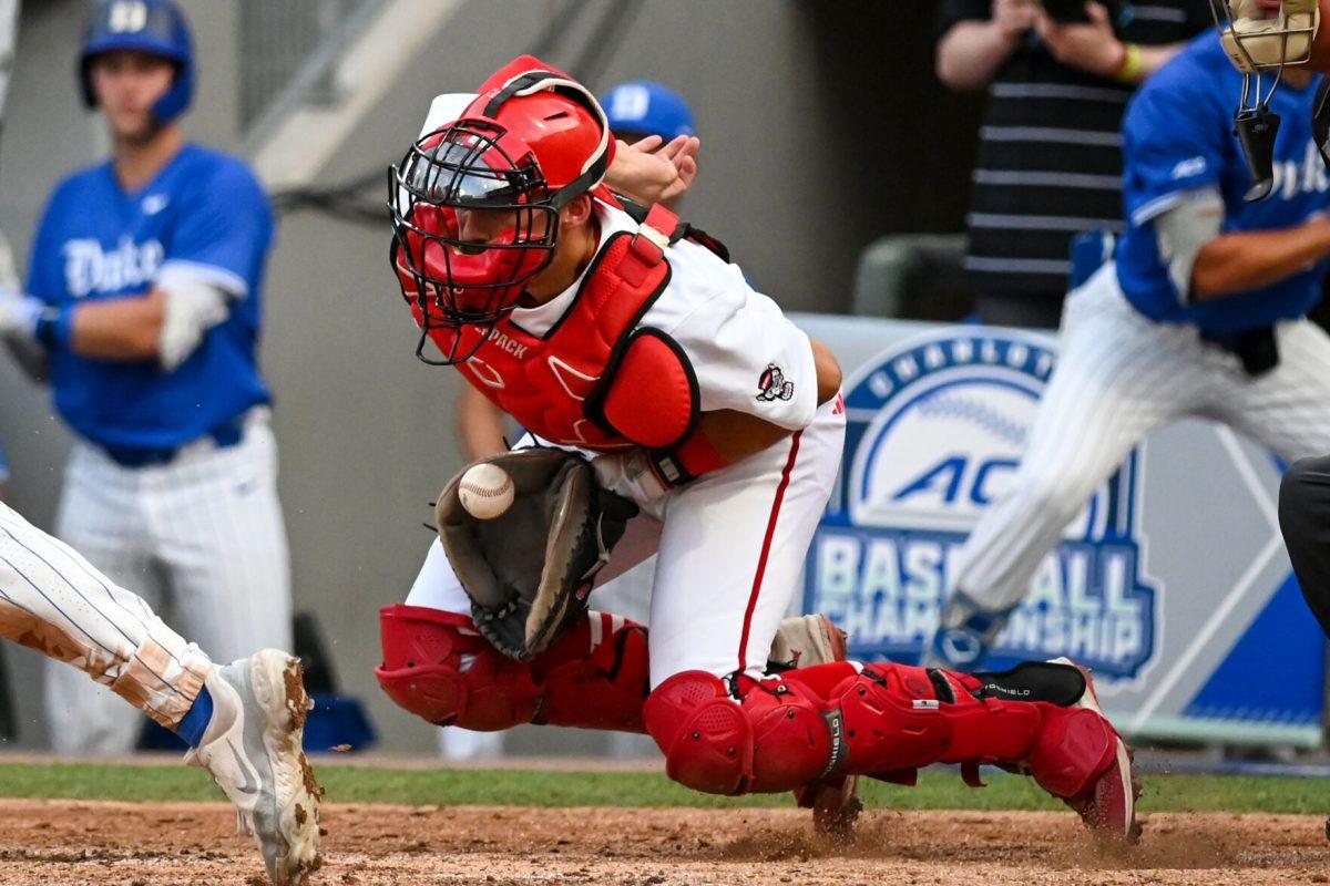 Junior catcher Jacob Cozart catches the ball during the ACC Tournament game against Duke at Truist Field in Charlotte on Thursday, May 23, 2024. Cozart batted one runner in. NC State lost to Duke 8-1.