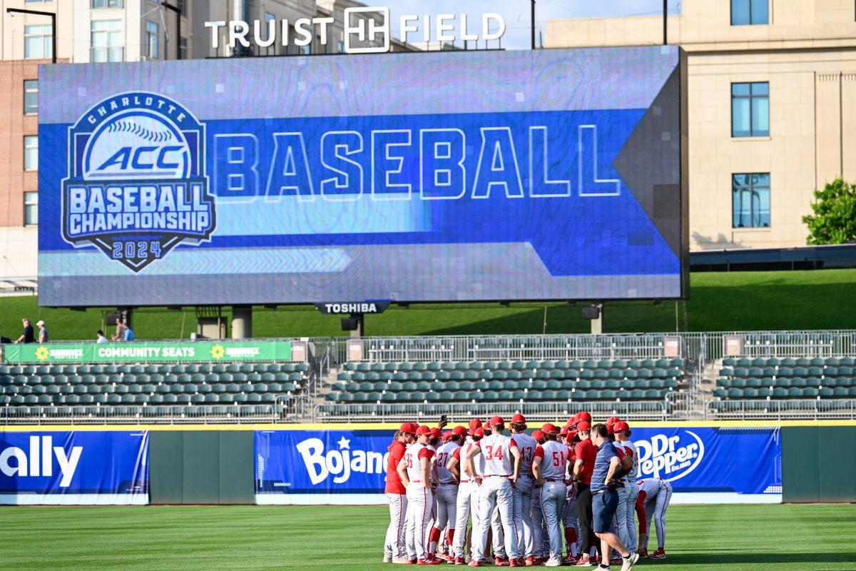 NC State huddles together before the ACC Tournament game against Virginia Tech at Truist Field in Charlotte on Wednesday, May 22, 2024. NC State beat Virginia Tech 19-9 in eight innings.