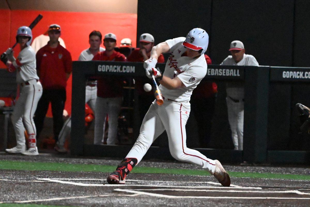 Graduate infielder Garrett Pennington swings for the ball during the game against UNC-Chapel Hill at Doak Field at Dail Park on Thursday, April 18, 2024. NC State won 9-8.