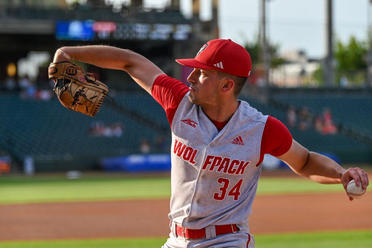 Senior pitcher PJ Labriola warms up before the ACC Tournament game against Virginia Tech at Truist Field in Charlotte on Wednesday, May 22, 2024. Labriola recorded six strikeouts in 2.2 innings pitched. NC State beat Virginia Tech 19-9 in eight innings.