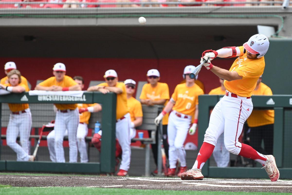 Junior catcher Jacob Cozart hits a home run during the inaugural Victory Over Cancer game against Ball State at Doak Field at Dail Park on Sunday, April 28, 2024. NC State raised $50,860 for pediatric cancer research. NC State beat Ball State 11-3 and swept the series.