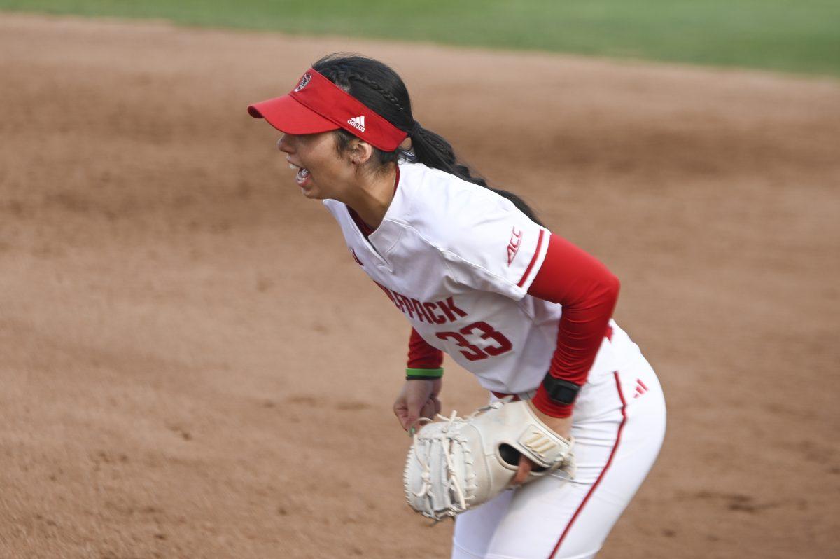 Junior first base player Alaina Smith yells at her teammates during the game against Duke at Dali Softball Field on April 26, 2024. NC State lost to Duke 4-3.