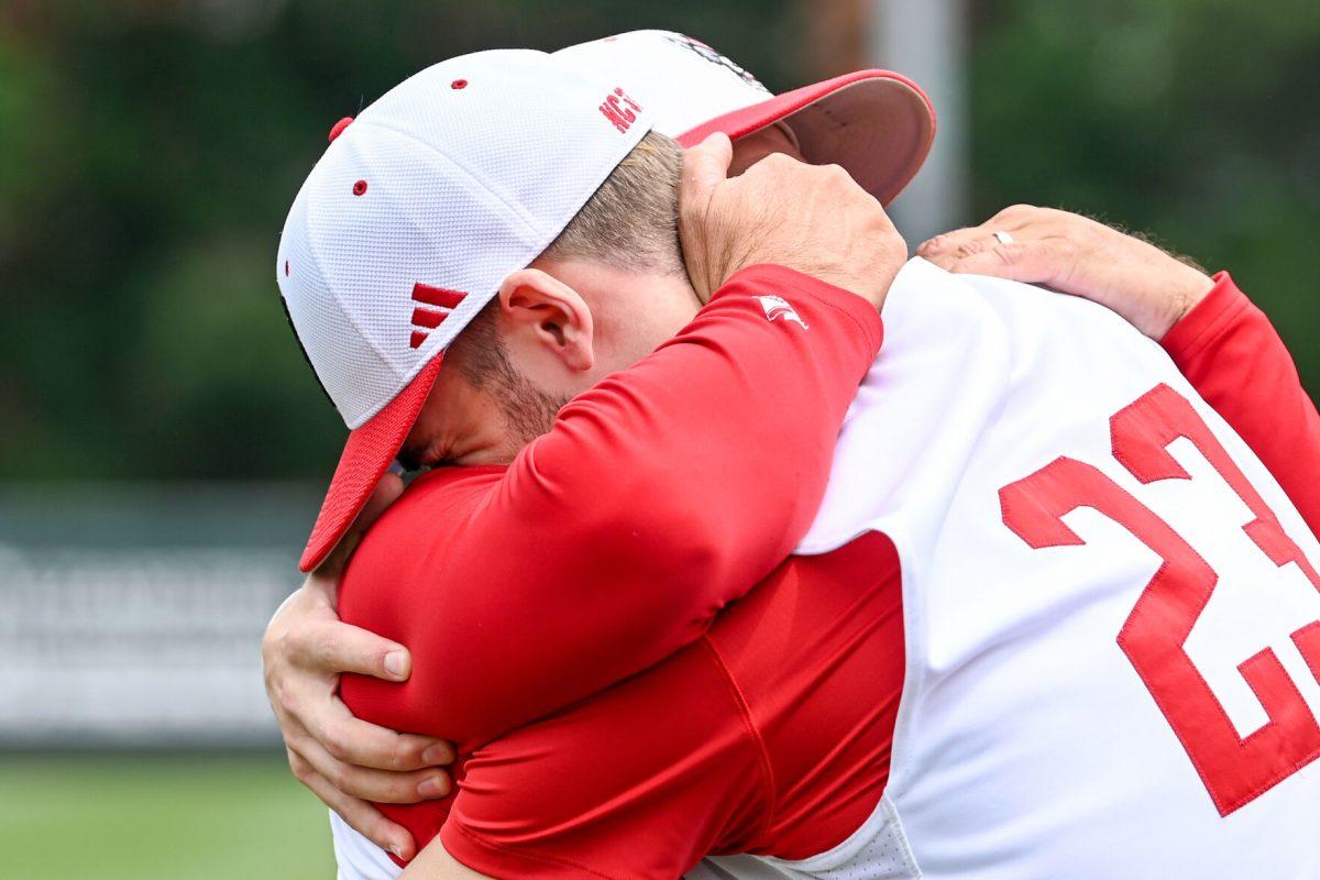 Head coach Elliot Avent and senior pitcher Matt Willadsen hug while celebrating Senior Day before the game against Wake Forest at Doak Field at Dail Park on Saturday, May 18, 2024. NC State beat Wake Forest 9-6 and swept the series.