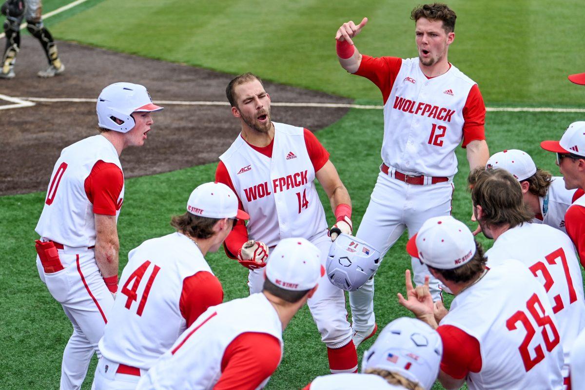Junior catcher Jacob Cozart celebrates with his teammates at home plate after hitting a home run during the game against Wake Forest at Doak Field at Dail Park on Saturday, May 18, 2024. Cozart recorded one run and three RBIs. NC State beat Wake Forest 9-6 and swept the series.
