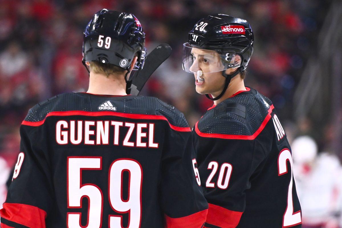 Center Sebastian Aho (right) talks with center Jake Guentzel during the Carolina Hurricanes game versus the Washington Capitals at PNC Arena on Friday, April 5, 2024. Guentzel scored two goals for the Hurricanes. Aho scored one goal for the Hurricanes. The Hurricanes beat the Capitals 4-2.