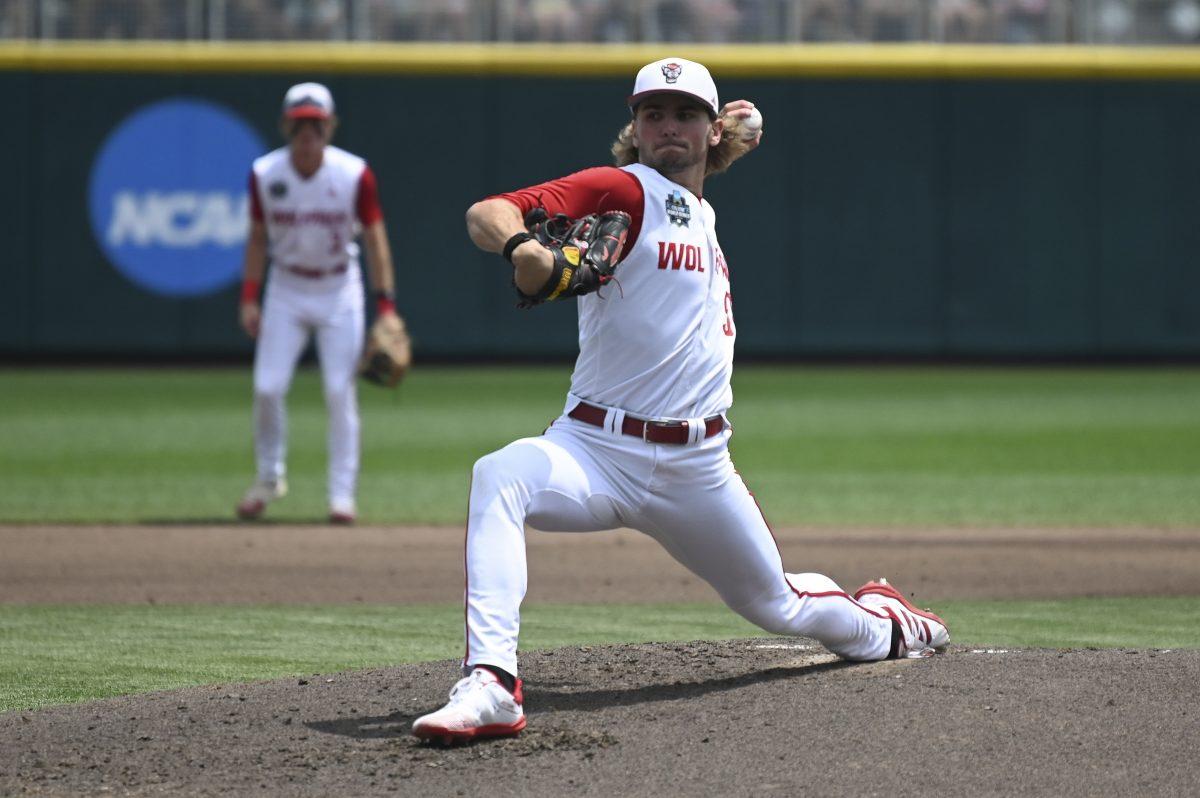 Sophomore pitcher Dominic Fritton pitches during the Wolfpack's Men's College World Series game against the Florida Gators on Charles Schwab Field in Omaha, Nebraska on Monday, June 17, 2024. The Gators defeated the Wolfpack 5-4.