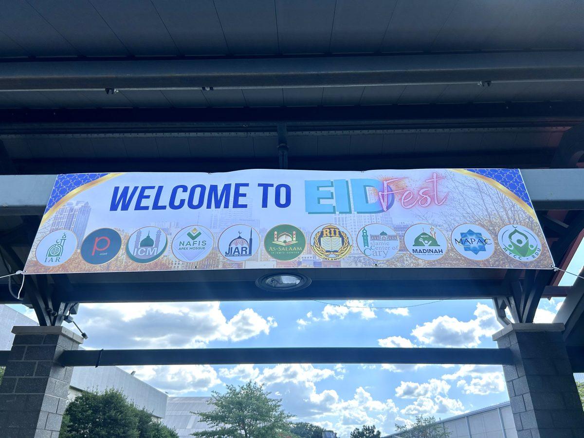 A sign welcomes attendees to Eid Fest in Raleigh on Saturday, June 22, 2024. Eleven mosques partnered to host the celebration of Eid al-Adha at the Jim Graham Building on the NC State Fairgrounds.