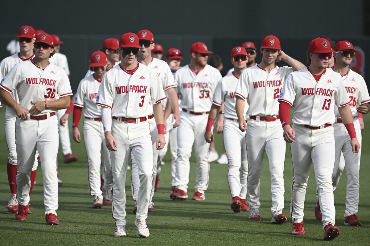 The NC State baseball team walks back to the dugout before the Wolfpack's NCAA Regional round game against the South Carolina Gamecocks on Doak Field at Dail Park on Saturday, June 1, 2024. The Wolfpack beat the Gamecocks 6-4.