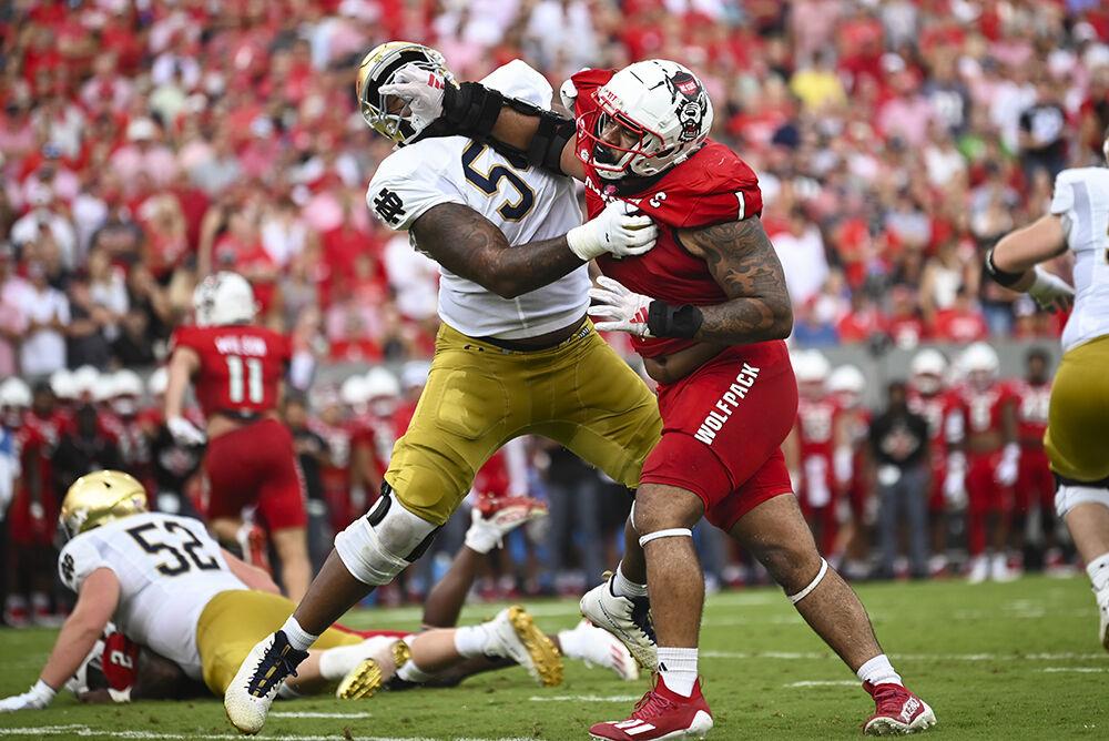 Junior defensive tackle Davin Vann reaches for his opponent during the game against Notre Dame at Carter-Finley Stadium on Saturday, Sept. 9, 2023. The Wolfpack fell to the Fighting Irish 45-24.