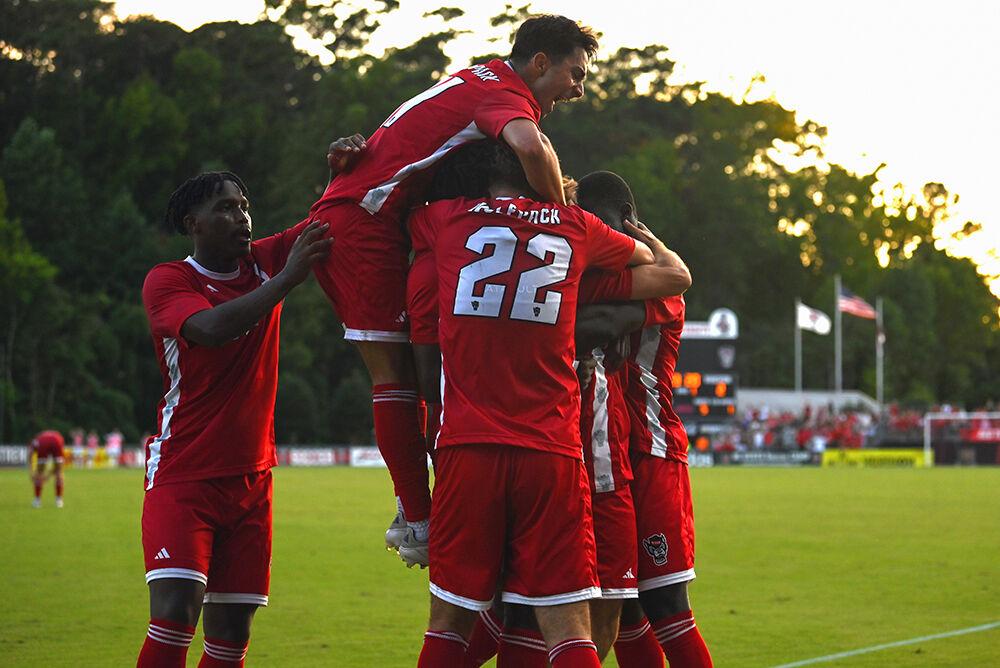 Members of NC State&#8217;s men&#8217;s soccer team celebrates the second goal of the game against High Point at Dail Soccer Field on Thursday, Aug. 22, 2024. NC State beat High Point 3-2.