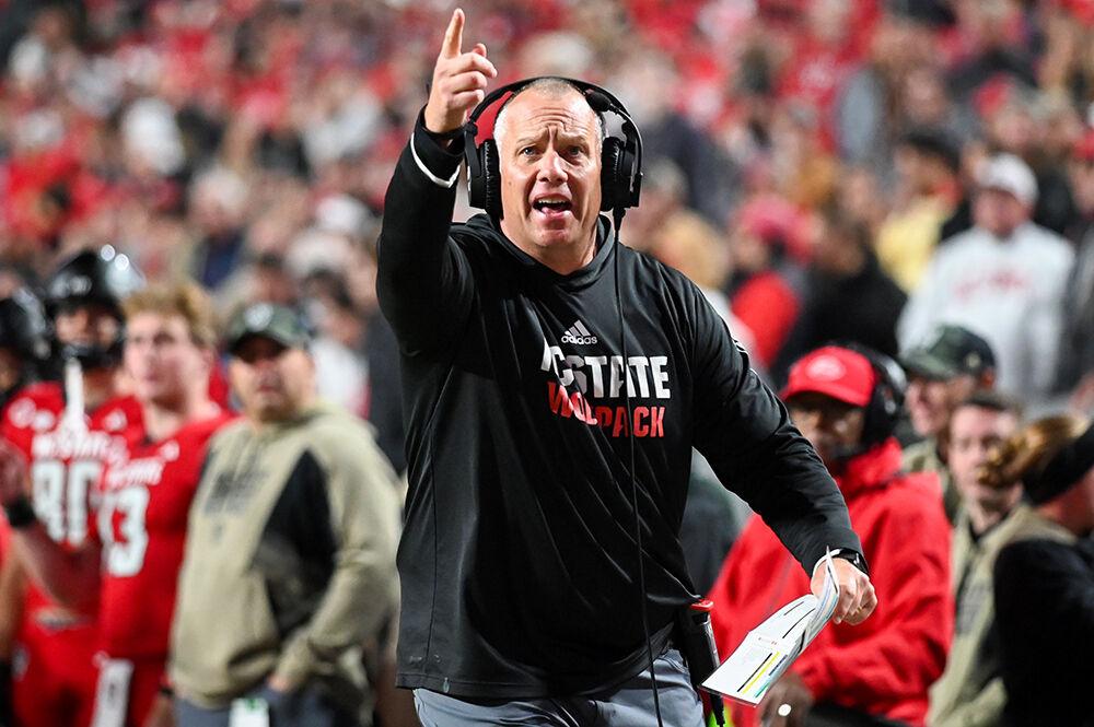 Head coach Dave Doeren points to the scoreboard and yells at the referee about an issue with the amount of time left of the clock during the game against Miami at Carter-Finley Stadium on Saturday, Nov. 4, 2023. This game marked Doeren's 78 win, the most in program history. NC State beat Miami 20-6.