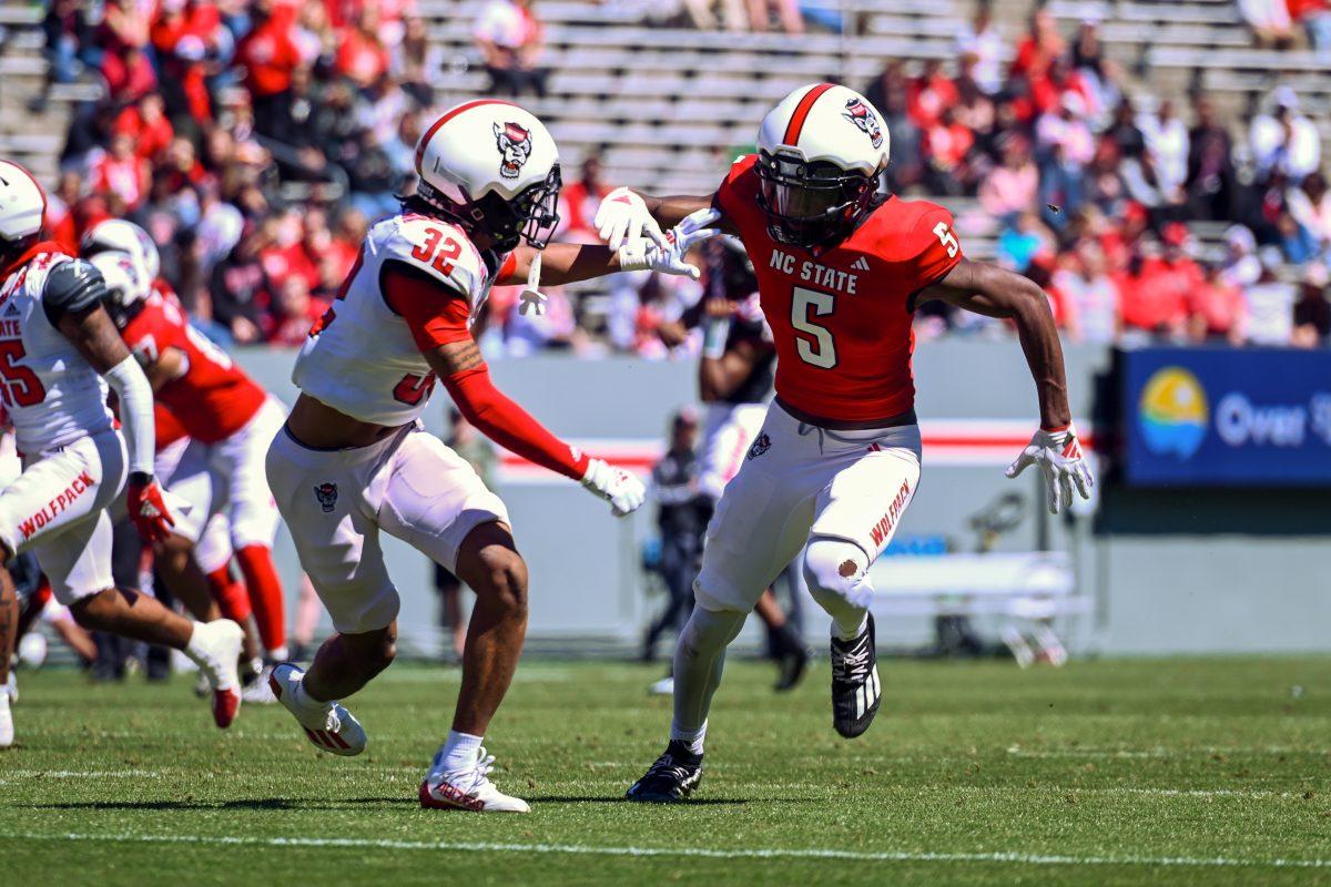 Redshirt freshman wide receiver Noah Rogers attempts to escape the cornerback during the spring game at Carter-Finley Stadium on Saturday, April 6, 2024. The Red team beat the White team 51-7.