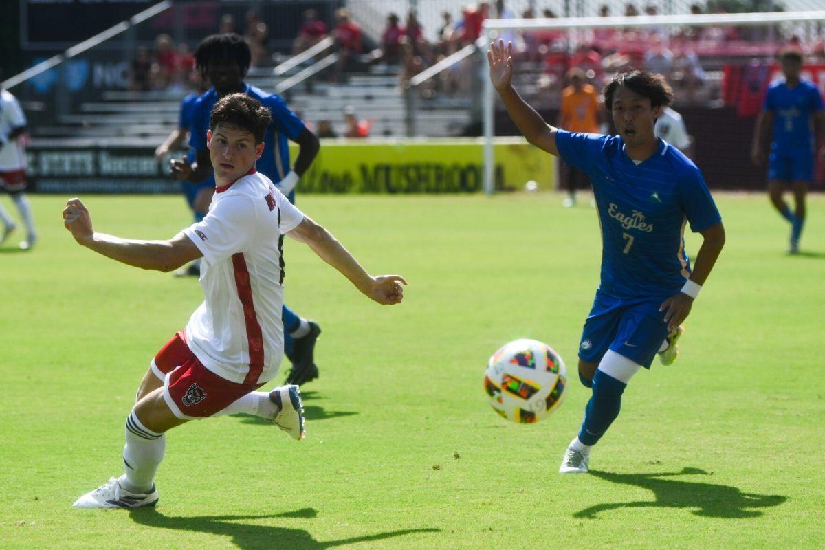 Redshirt sophomore center-back Isaac Heffess steals the ball from an Eagles player during the match against Florida Gulf Coast University at Dail Soccer Field on Sunday, Aug. 25, 2024. NC State won 1-0.
