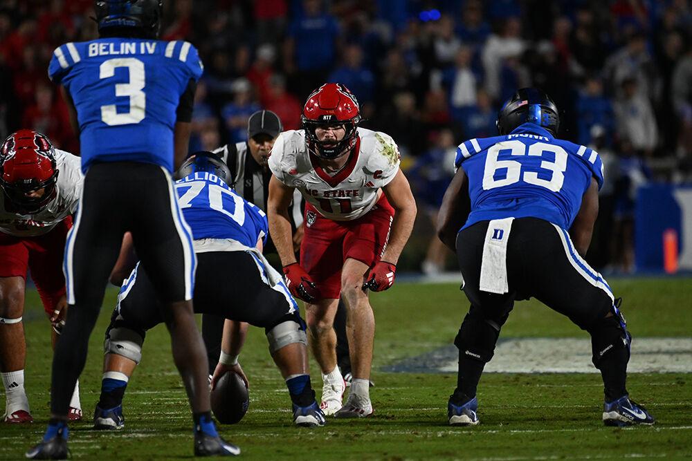 Graduate linebacker Payton Wilson approaches the line to shows blitz during the Wolfpack's game against the Duke Blue Devils at Wallace Wade Stadium on Saturday, Oct. 14, 2023. The Blue Devils defeated the Wolfpack 24-3.
