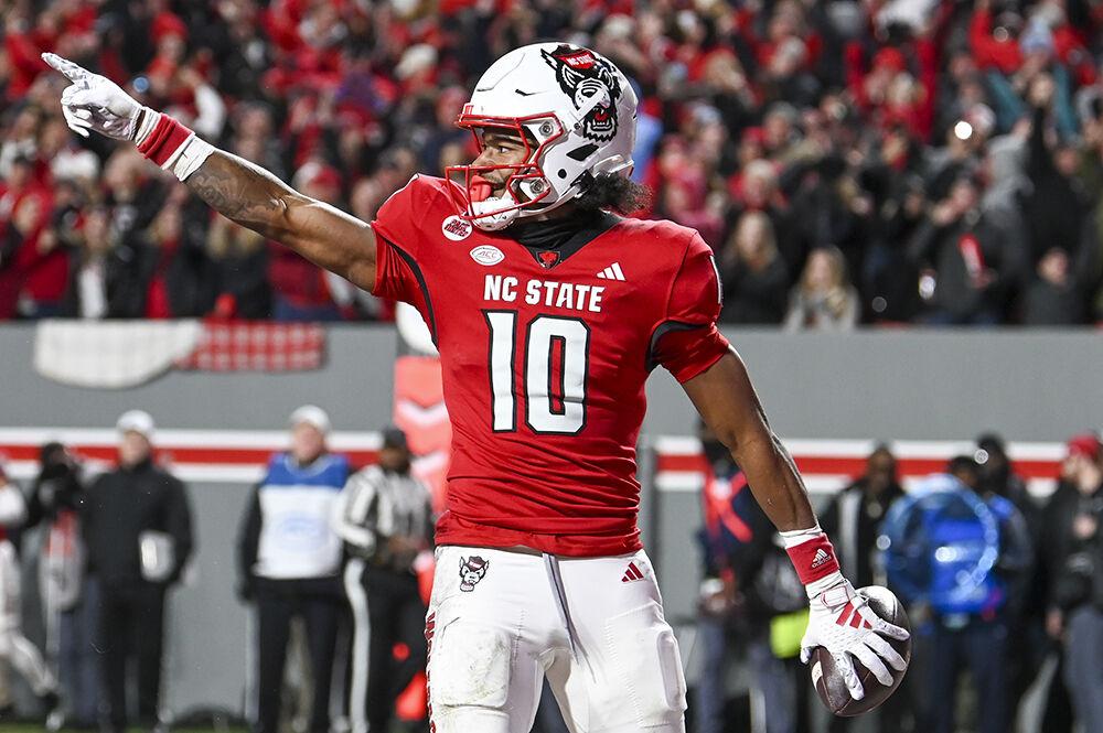 Freshman wide receiver Kevin Concepcion celebrates scoring a touchdown during the game against UNC-Chapel Hill in Carter-Finley Stadium on Saturday, Nov. 25, 2023. Concepcion scored two touchdowns. The Wolfpack beat the Tar Heels 39-20.