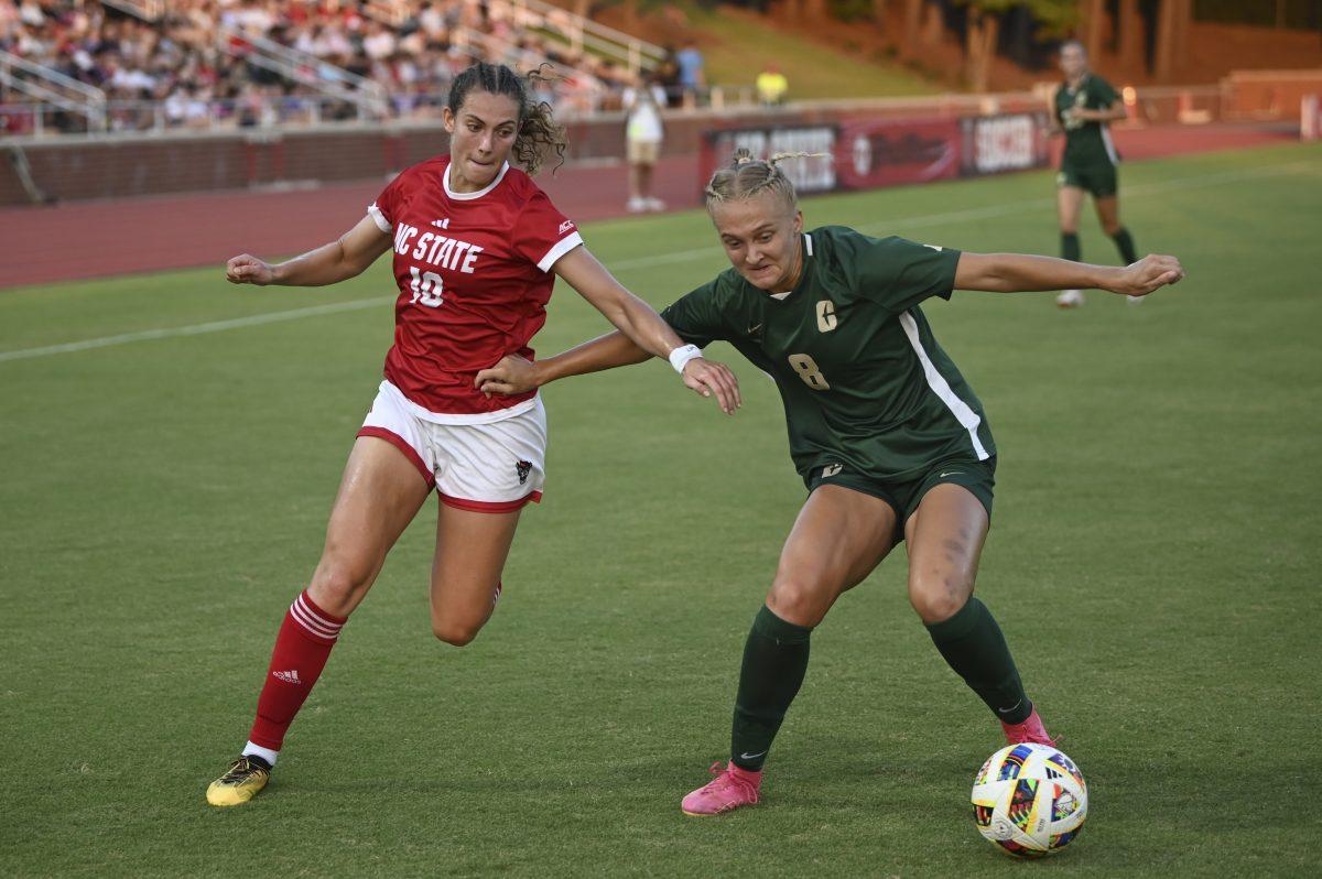 Senior midfielder Annika Wohner battles a defender for the ball during NC State's home game against Charlotte at Dail Soccer Field on Wednesday, Aug. 28, 2024. Wohner scored two goals. The Wolfpack beat the 49ers 3-1.