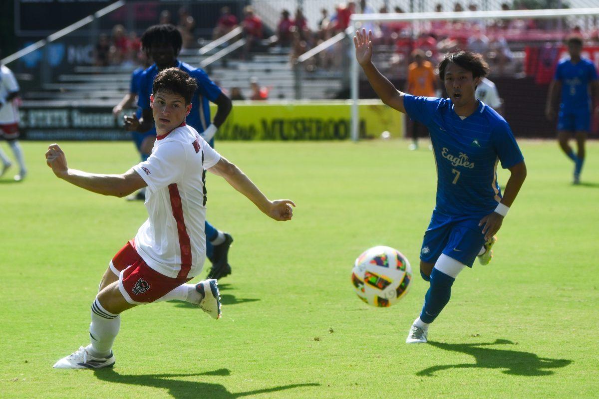 Redshirt sophomore center-back Isaac Heffess steals the ball from an Eagles player during the match against Florida Gulf Coast University at Dail Soccer Field on Sunday, Aug. 25, 2024. NC State won 1-0.