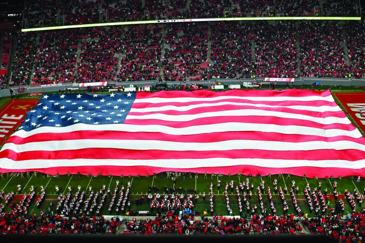 The United States flag is displayed on the field during halftime at the military appreciation game against Miami at Carter-Finley Stadium on Saturday, Nov. 4, 2023. NC State beat Miami 20-6.