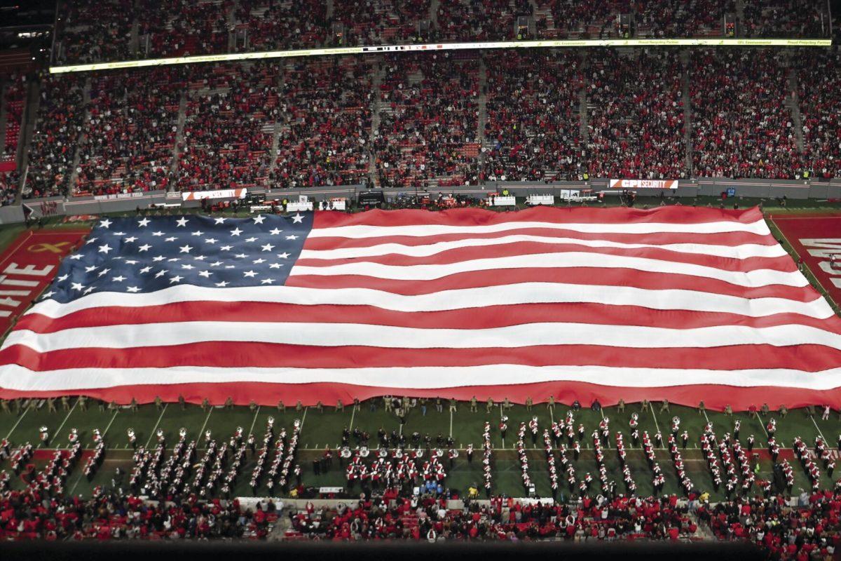 The United States flag is displayed on the field during halftime at the military appreciation game against Miami at Carter-Finley Stadium on Saturday, Nov. 4, 2023. NC State beat Miami 20-6.
