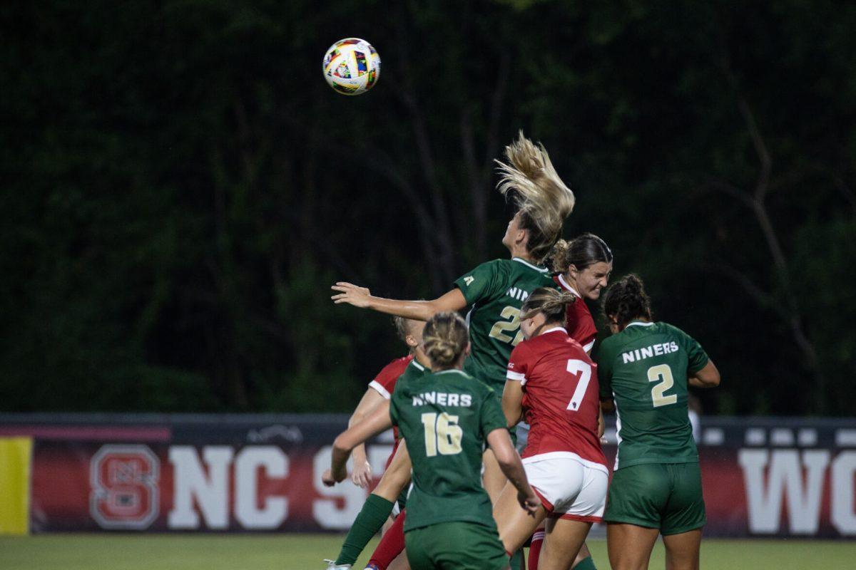 The Wolfpack and the 49ers crash together during the match against the University of North Carolina Charlotte at Dail Soccer Field on Wednesday, Aug. 28, 2024. NC State beat UNC Charlotte 3-1.