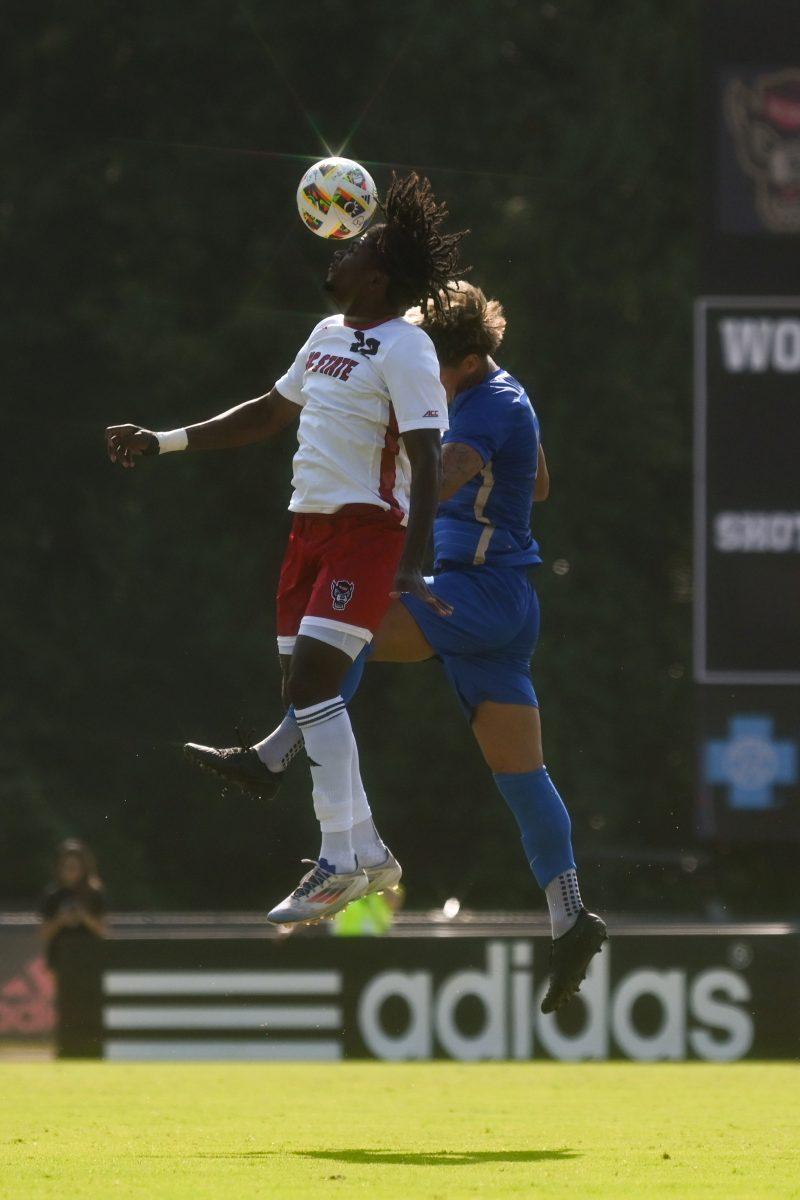 Forward sophomore Donavan Phillip headbutts the ball during the match against Florida Gulf Coast University at Dail Soccer Field on Sunday, Aug. 25, 2024. NC State won 1-0.