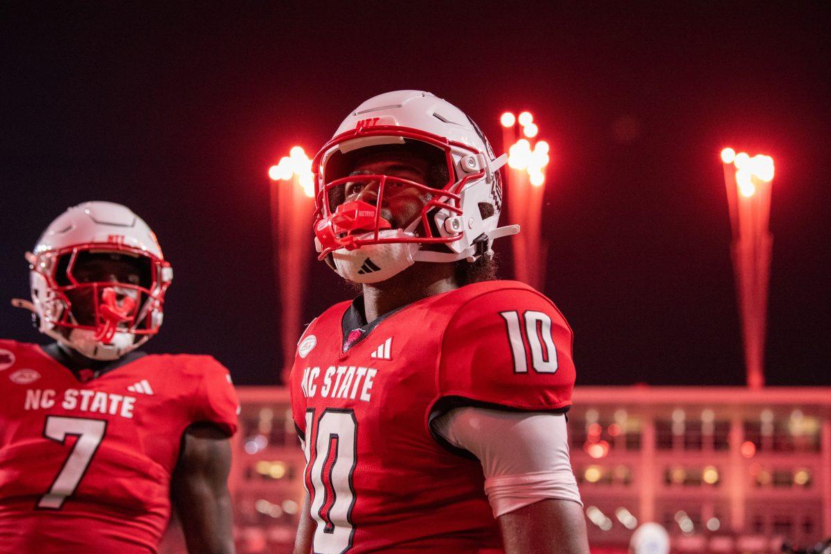 Sophomore wide receiver KC Concepcion looks out at the crowd after a touchdown as fireworks explode during the game against Western Carolina at Carter-Finley Stadium on Thursday, Aug. 29, 2024. Concepcion scored three touchdowns. The Wolfpack defeated the Catamounts 38-21.