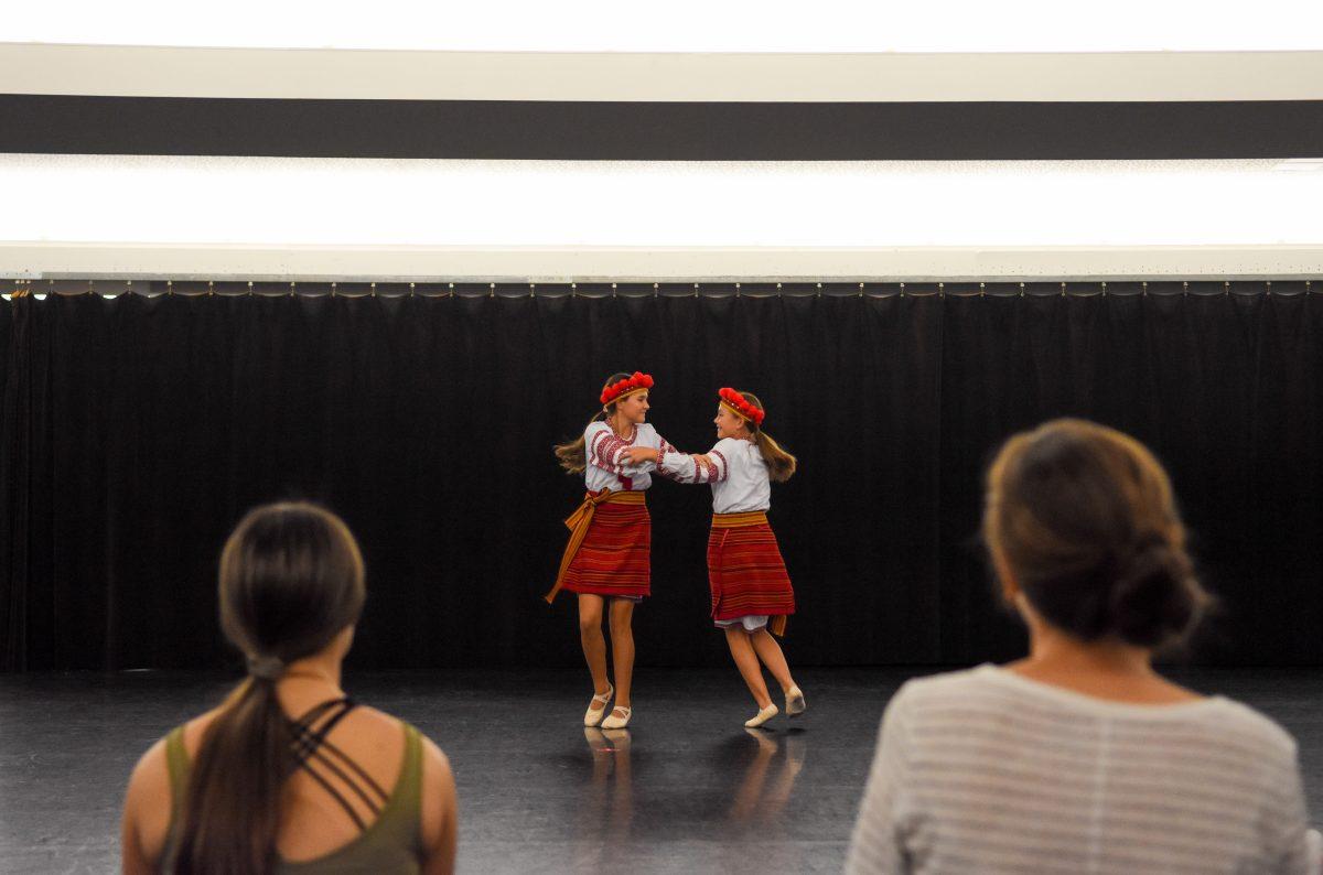 Zoriana Korzeniowski and Nadia Korzeniowski perform for participants during the Ukranian Dance Workshop at Carmicheal Gym on Thursday, Sept. 12, 2024. This event was held by members of Tsvitinnya's North Carolina Ukrainian Dance Ensemble.