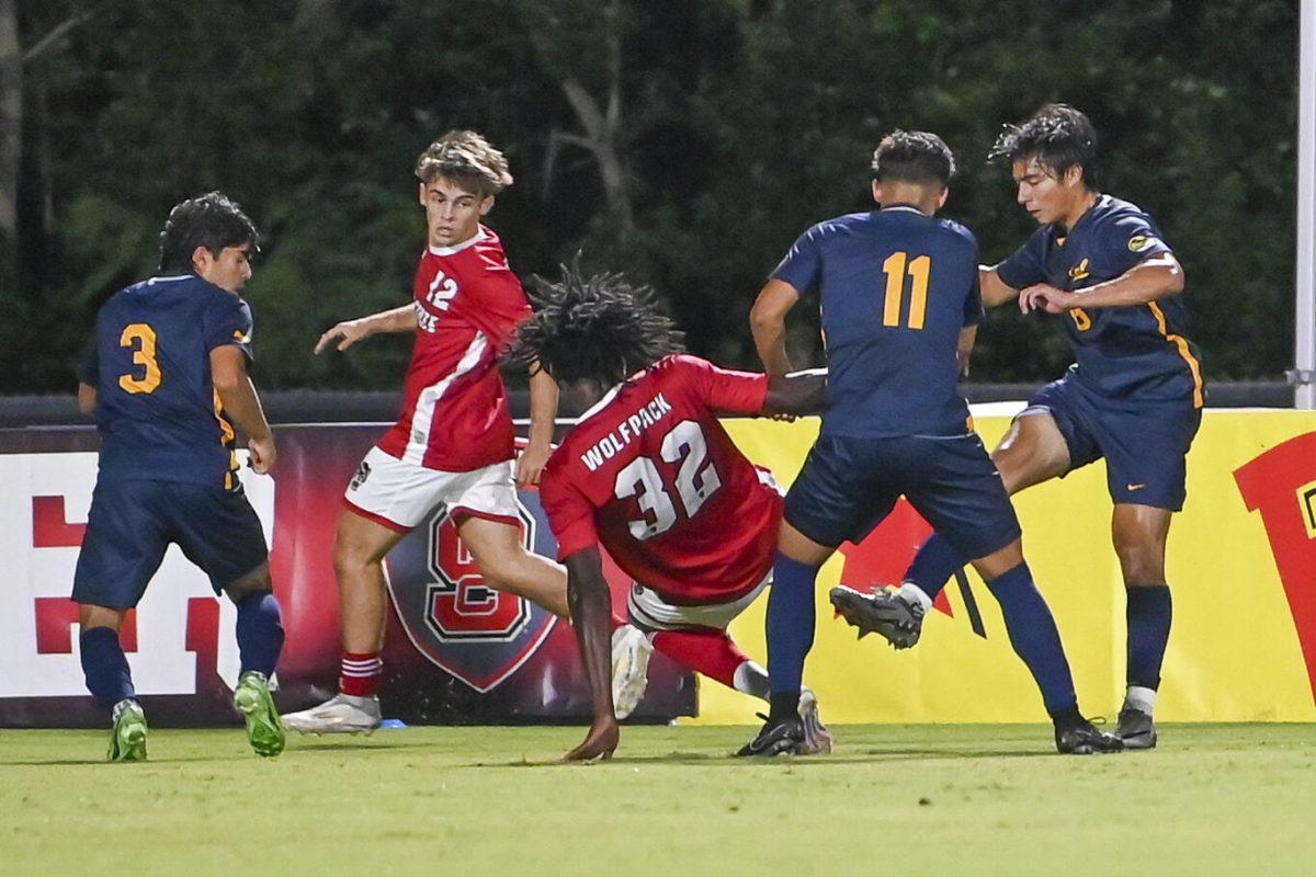 Junior midfielder Taig Healy and sophomore forward Donavan Philip fight for the ball during the game against Cal at Dail Soccer Field on Friday, Sept. 6, 2024. NC State beat Cal 2-1.