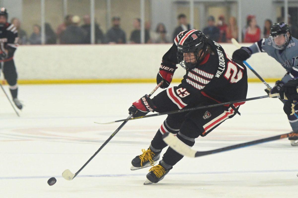Freshman forward Brooks Willoughby-Ray controls the puck during the game against High Point University at Invisalign Arena on Friday, Sept. 6, 2024. Willoughby-Ray scored the first goal of the game. NC State won 8-2.